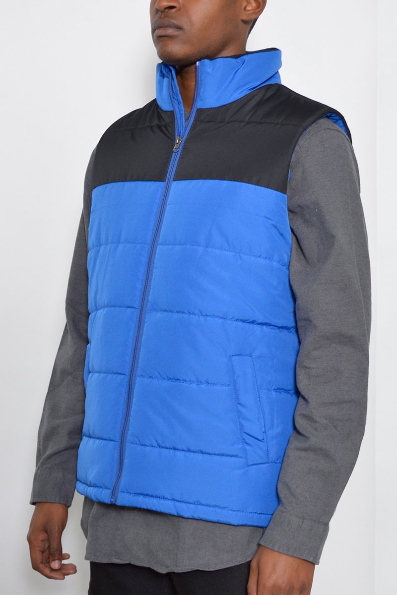 A stylish two-tone padded vest made of 100% polyester, featuring a modern design suitable for layering.