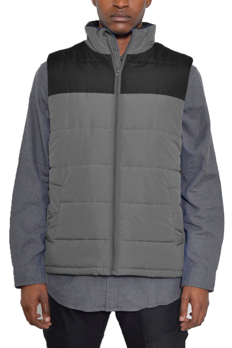 A stylish two-tone padded vest in a modern design, showcasing its lightweight and warm features.