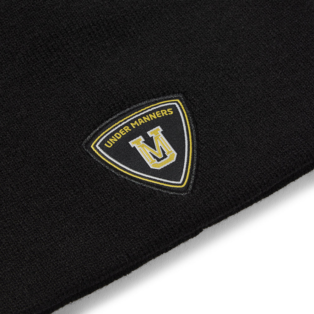 Under Manners Crest Beanie Unisex Hat made from soft 100% acrylic, featuring an iconic crest design.