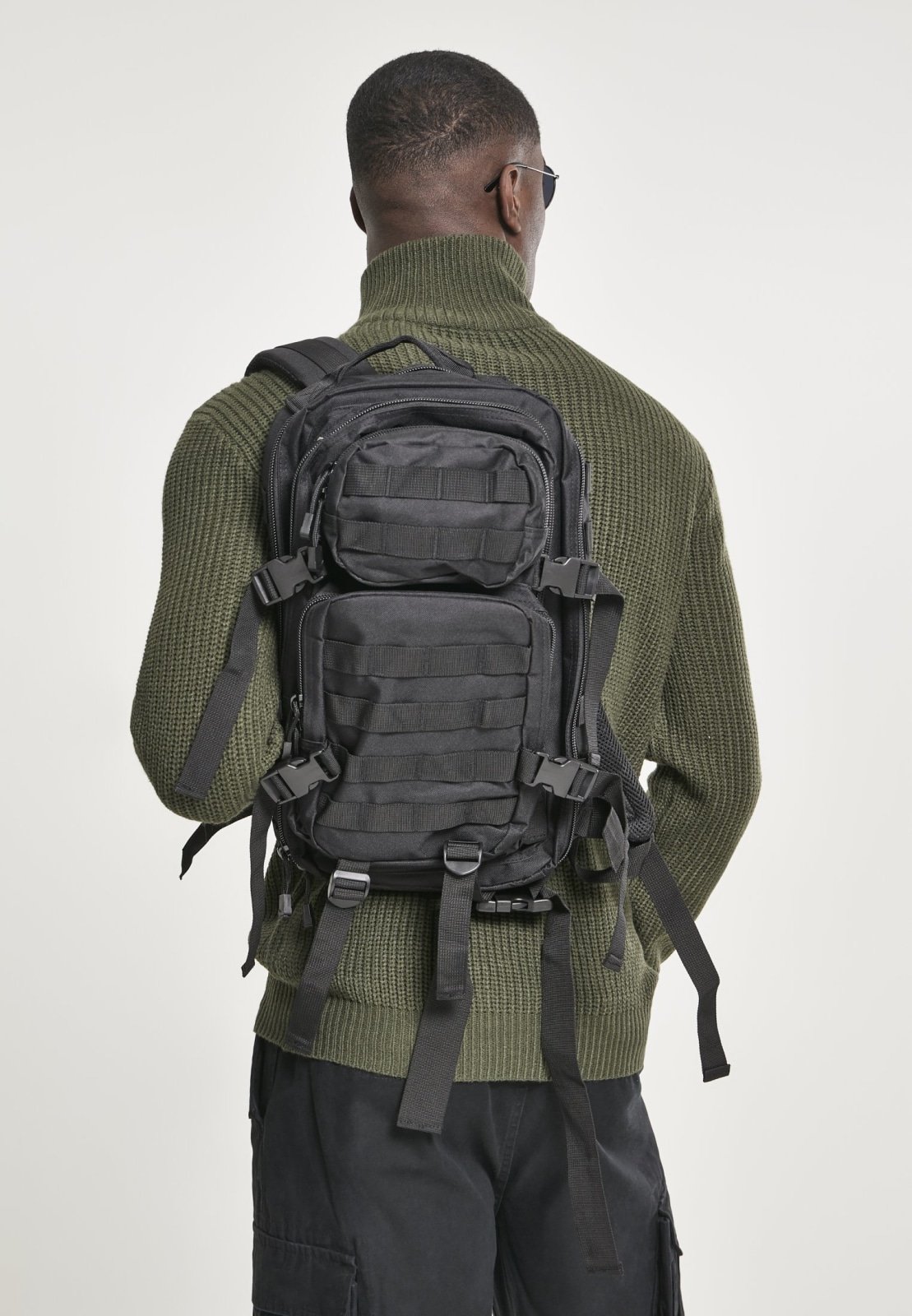 US Cooper Lasercut Medium backpack featuring a lasercut MOLLE system, padded shoulder straps, and adjustable waist strap in a tactical design.