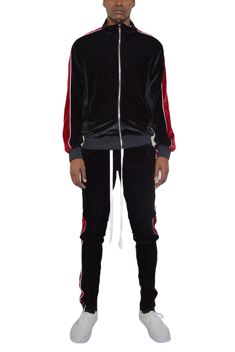 A stylish velour track set featuring a slim fit, standard pockets, and a hidden ankle zipper, perfect for casual wear.