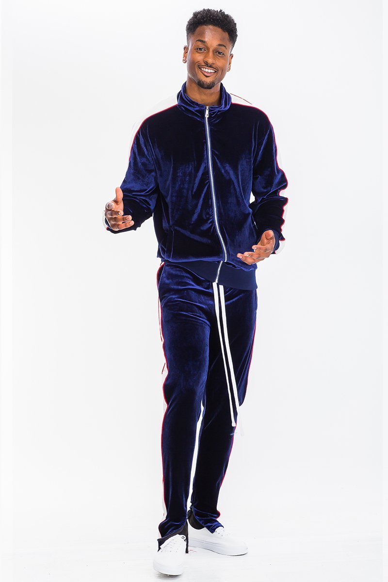 A stylish velour track set featuring a slim fit, hidden ankle zippers, and standard pockets, perfect for workouts or casual wear.