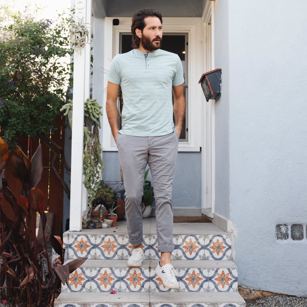 Wade Pinstripe Henley shirt featuring short sleeves, a patch pocket, and a contrast placket, made from a cotton-polyester blend.