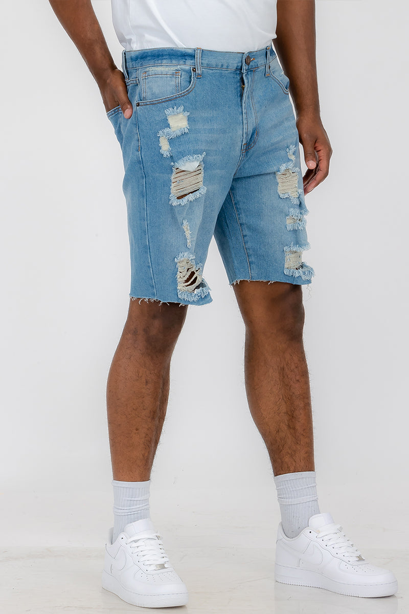 A pair of washed distressed denim shorts featuring a button closure waist and standard pockets, styled for a casual summer look.