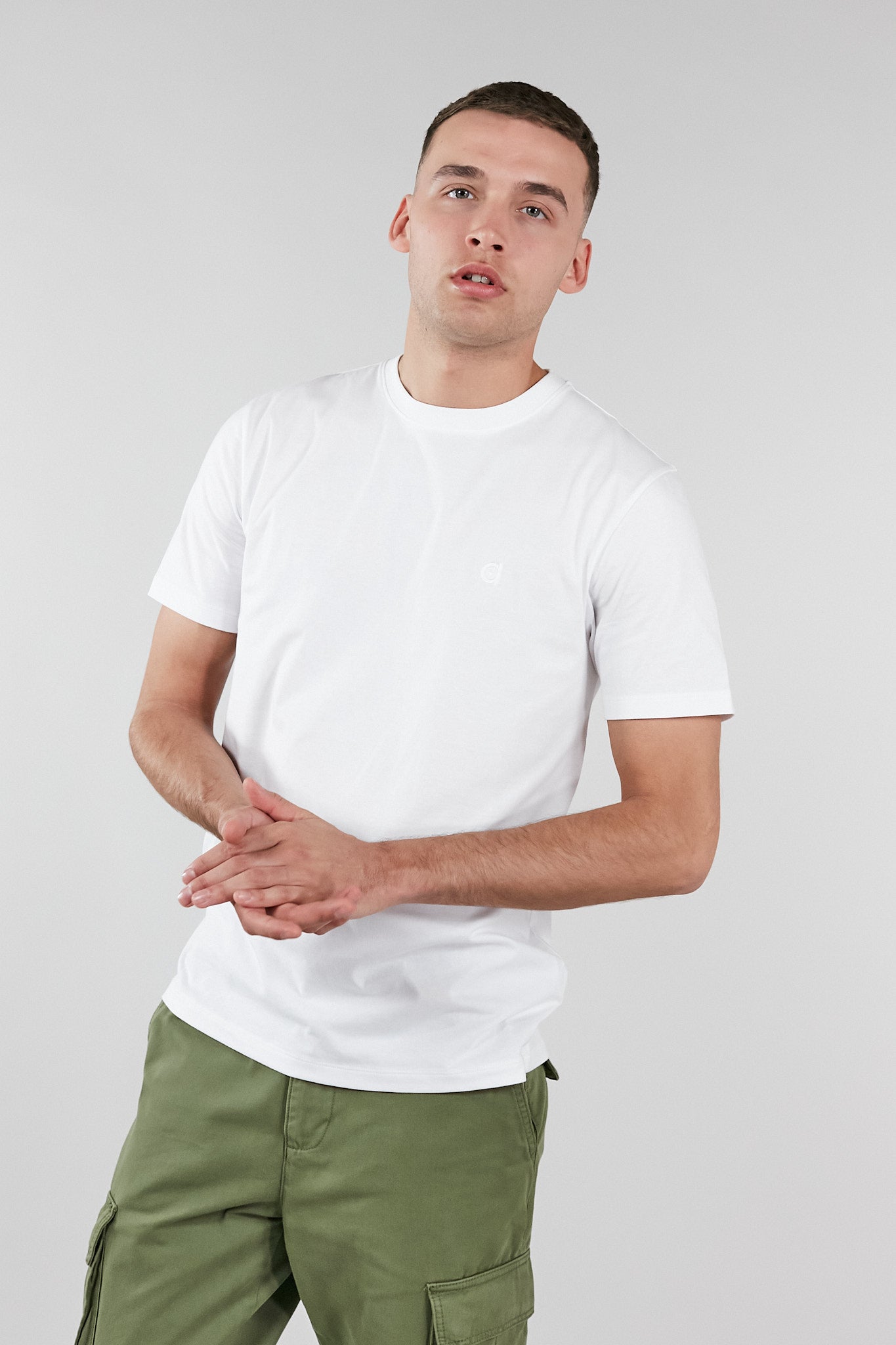 A soft touch white low carbon t-shirt made from 100% organic cotton with an embroidered altid logo.