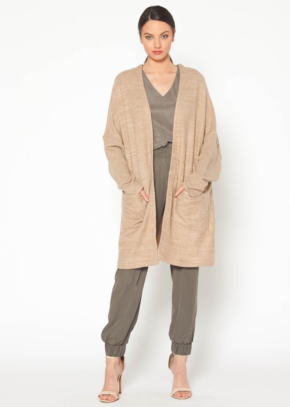 A stylish Women's Basic Cardigan in Camel color, showcasing its soft fabric and relaxed fit, perfect for layering.