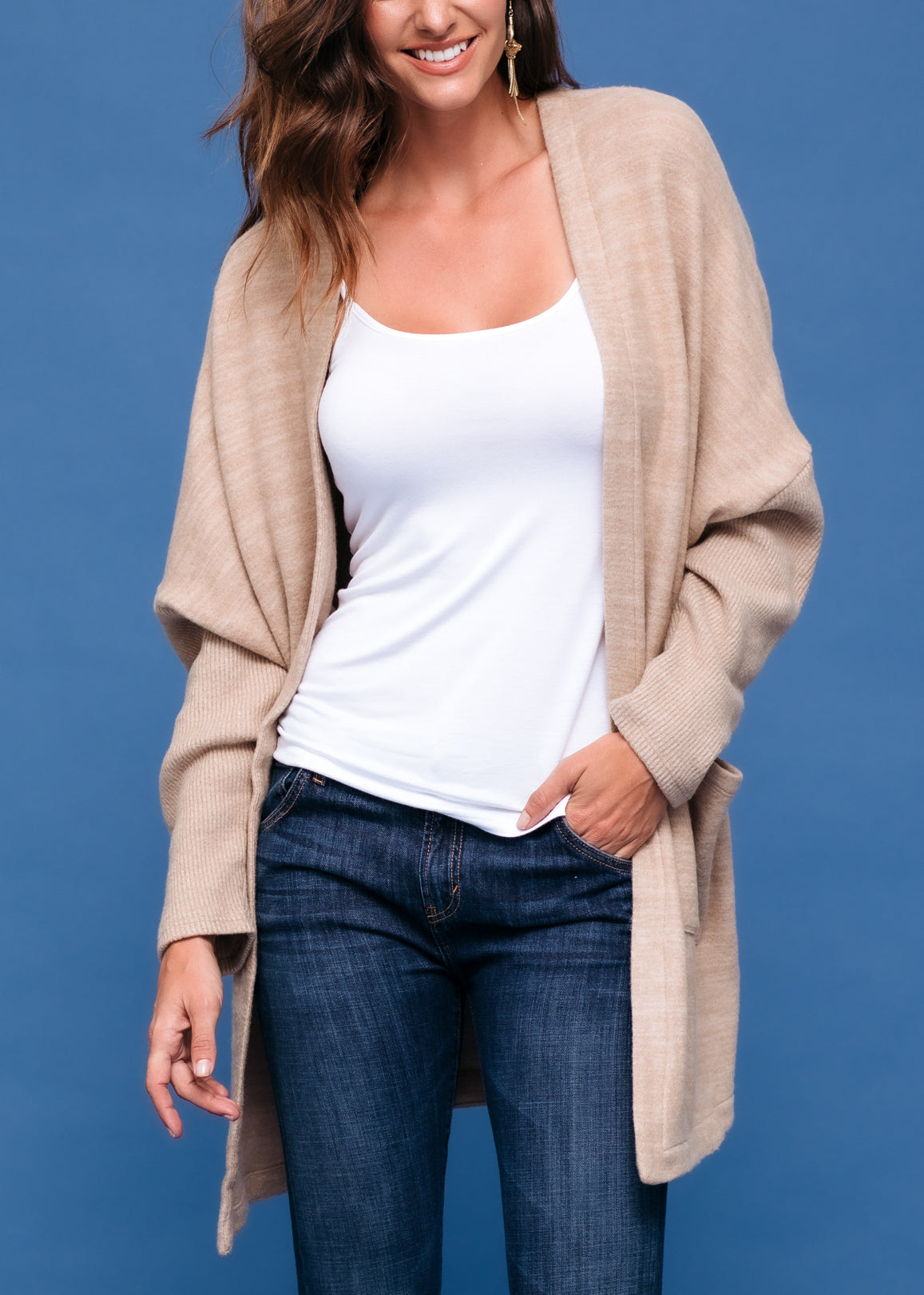 A stylish Women's Basic Cardigan in Camel color, showcasing its soft fabric and relaxed fit, perfect for layering.