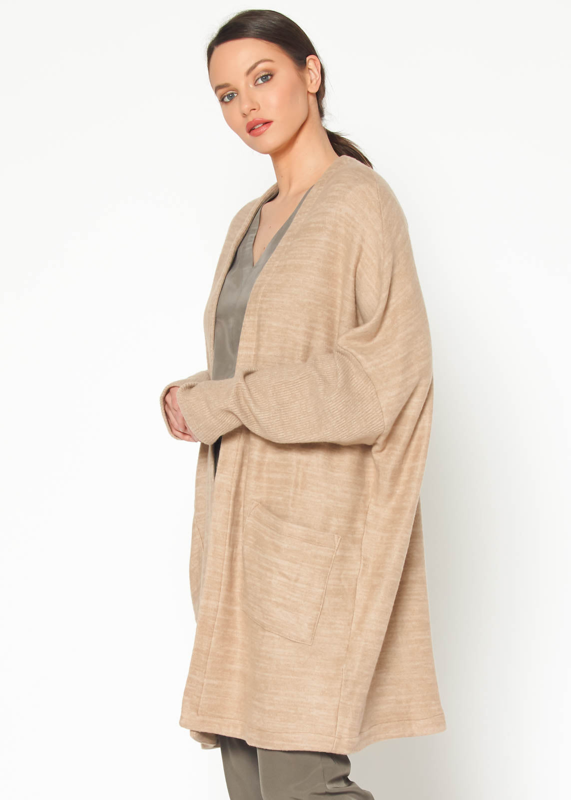 A stylish Women's Basic Cardigan in Camel color, showcasing its soft fabric and relaxed fit, perfect for layering.