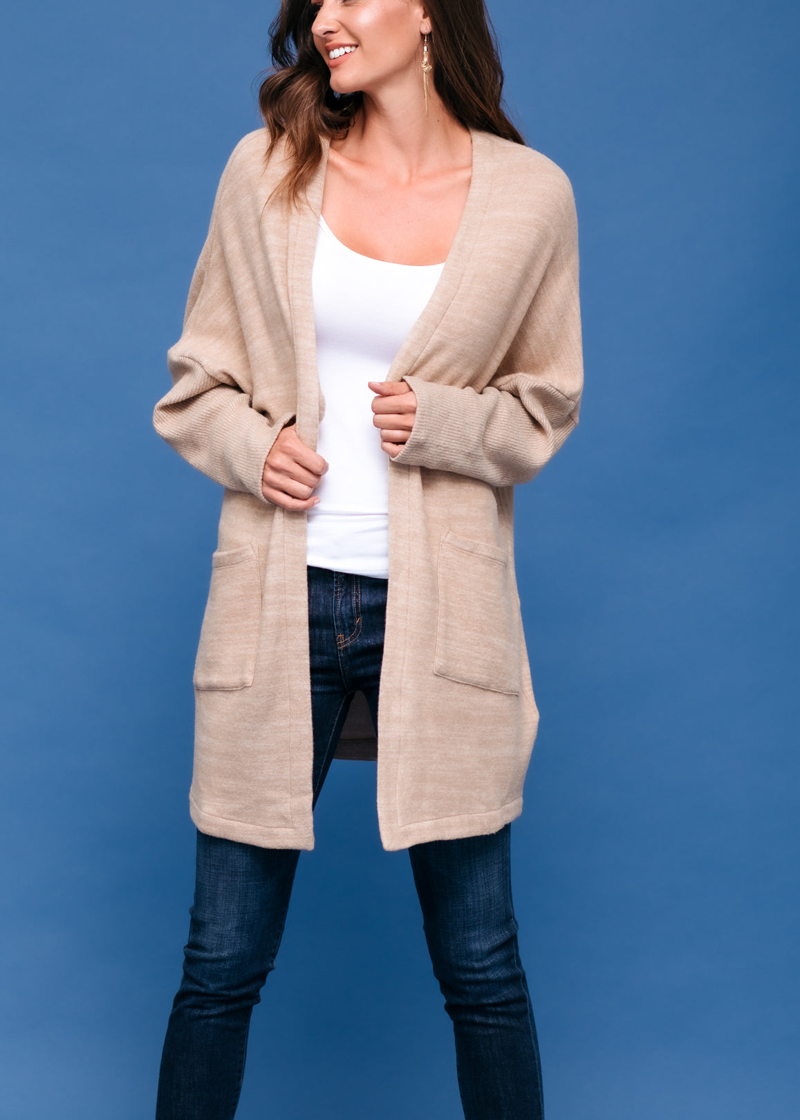 A stylish Women's Basic Cardigan in Camel color, showcasing its soft fabric and relaxed fit, perfect for layering.