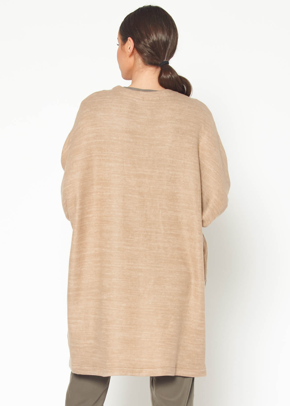 A stylish Women's Basic Cardigan in Camel color, showcasing its soft fabric and relaxed fit, perfect for layering.