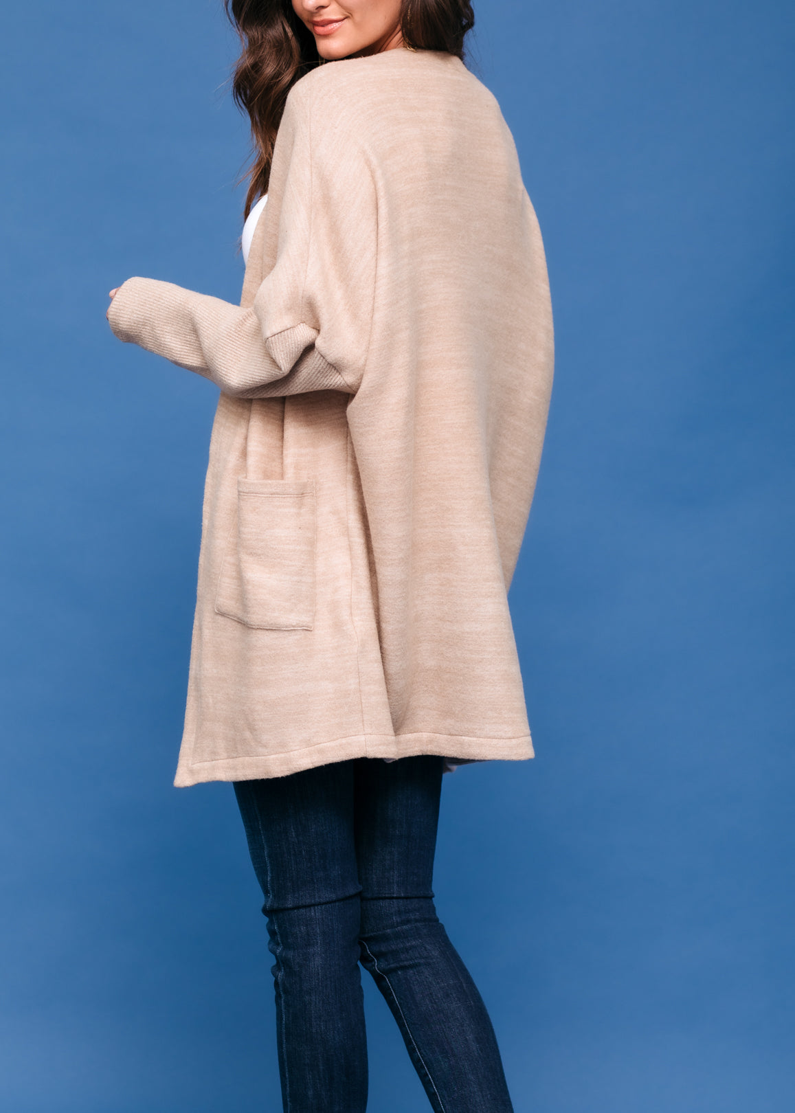 A stylish Women's Basic Cardigan in Camel color, showcasing its soft fabric and relaxed fit, perfect for layering.