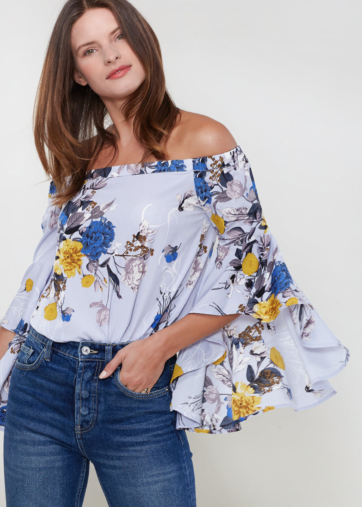 A stylish Women's Bell Sleeve Off The Shoulder Top featuring flowing bell sleeves and a comfortable off-the-shoulder design, made from 100% polyester.