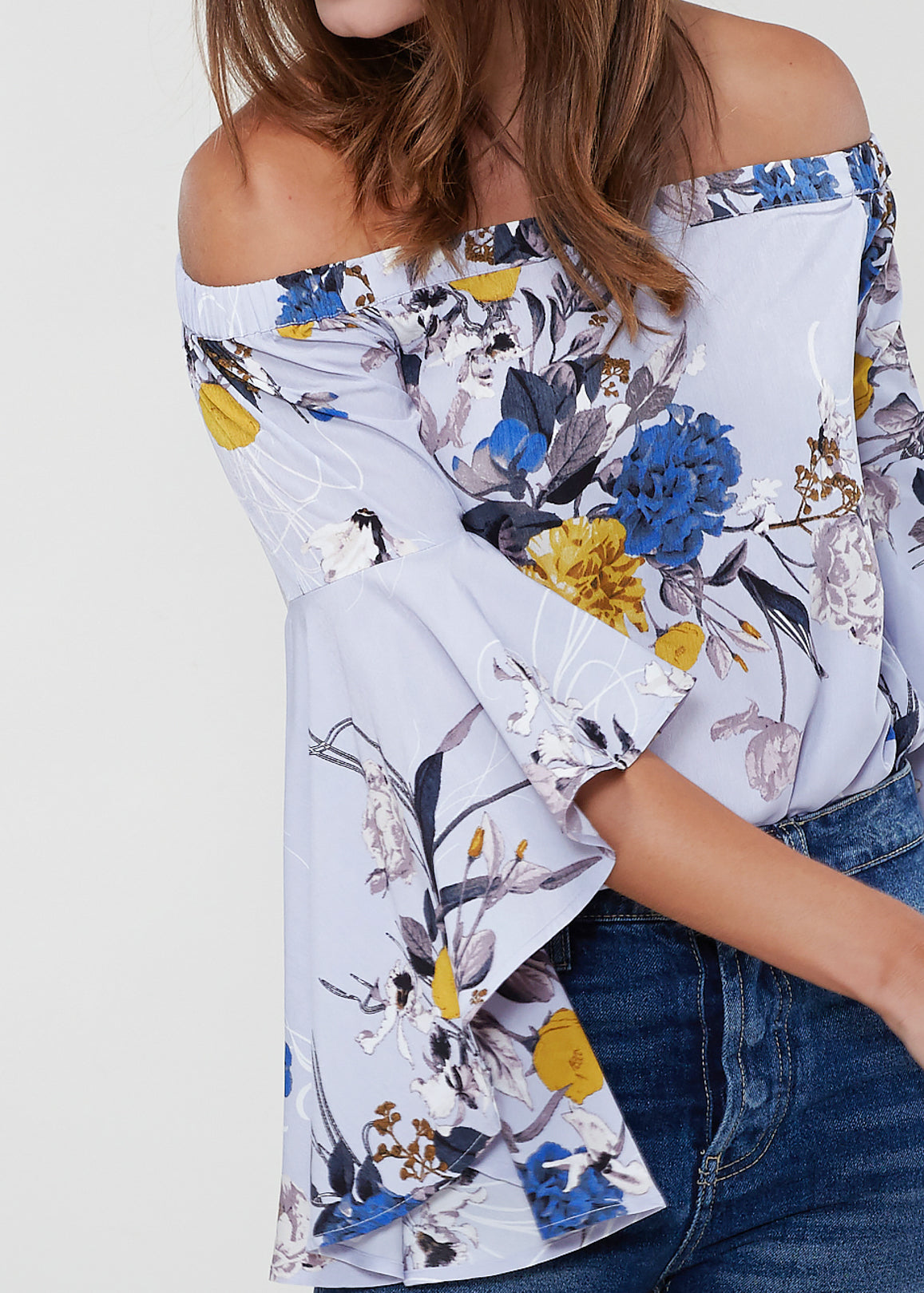 A stylish Women's Bell Sleeve Off The Shoulder Top featuring flowing bell sleeves and a comfortable off-the-shoulder design, made from 100% polyester.