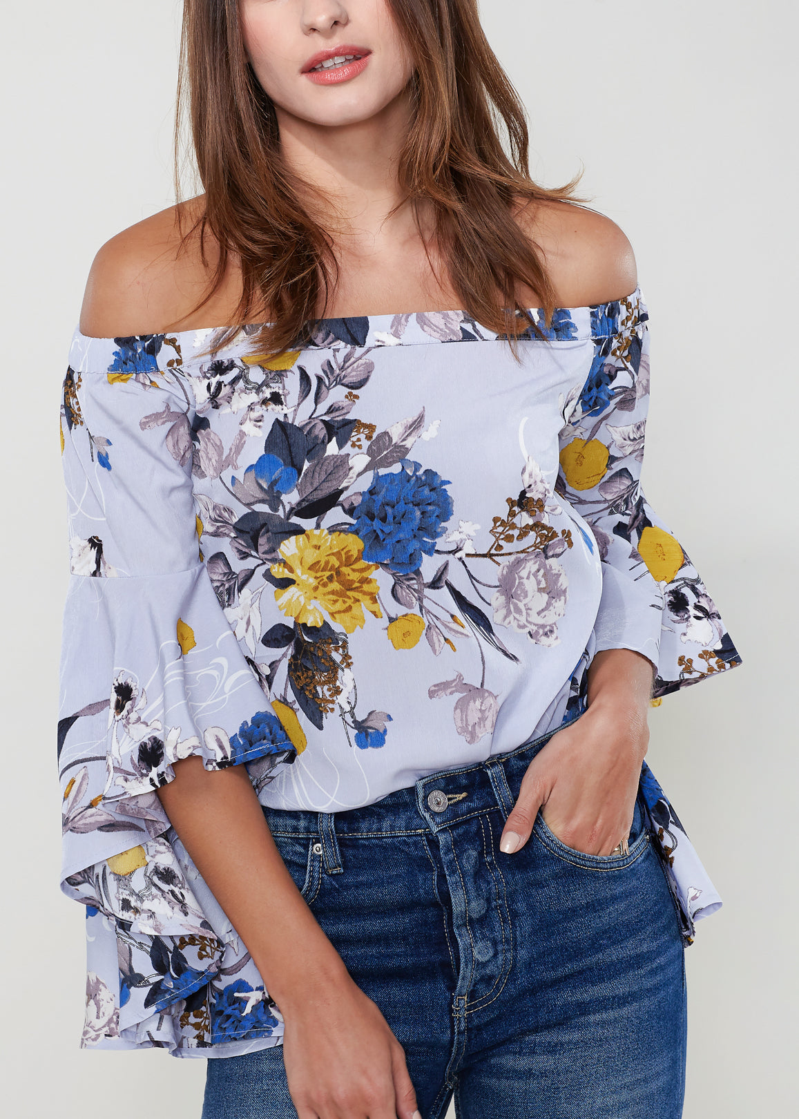 A stylish Women's Bell Sleeve Off The Shoulder Top featuring flowing bell sleeves and a comfortable off-the-shoulder design, made from 100% polyester.