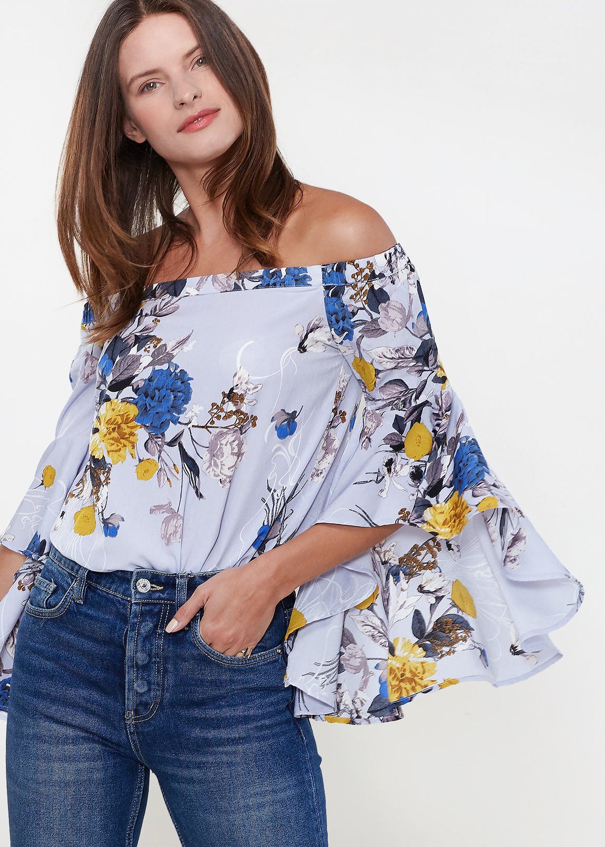 A stylish Women's Bell Sleeve Off The Shoulder Top featuring flowing bell sleeves and a comfortable off-the-shoulder design, made from 100% polyester.