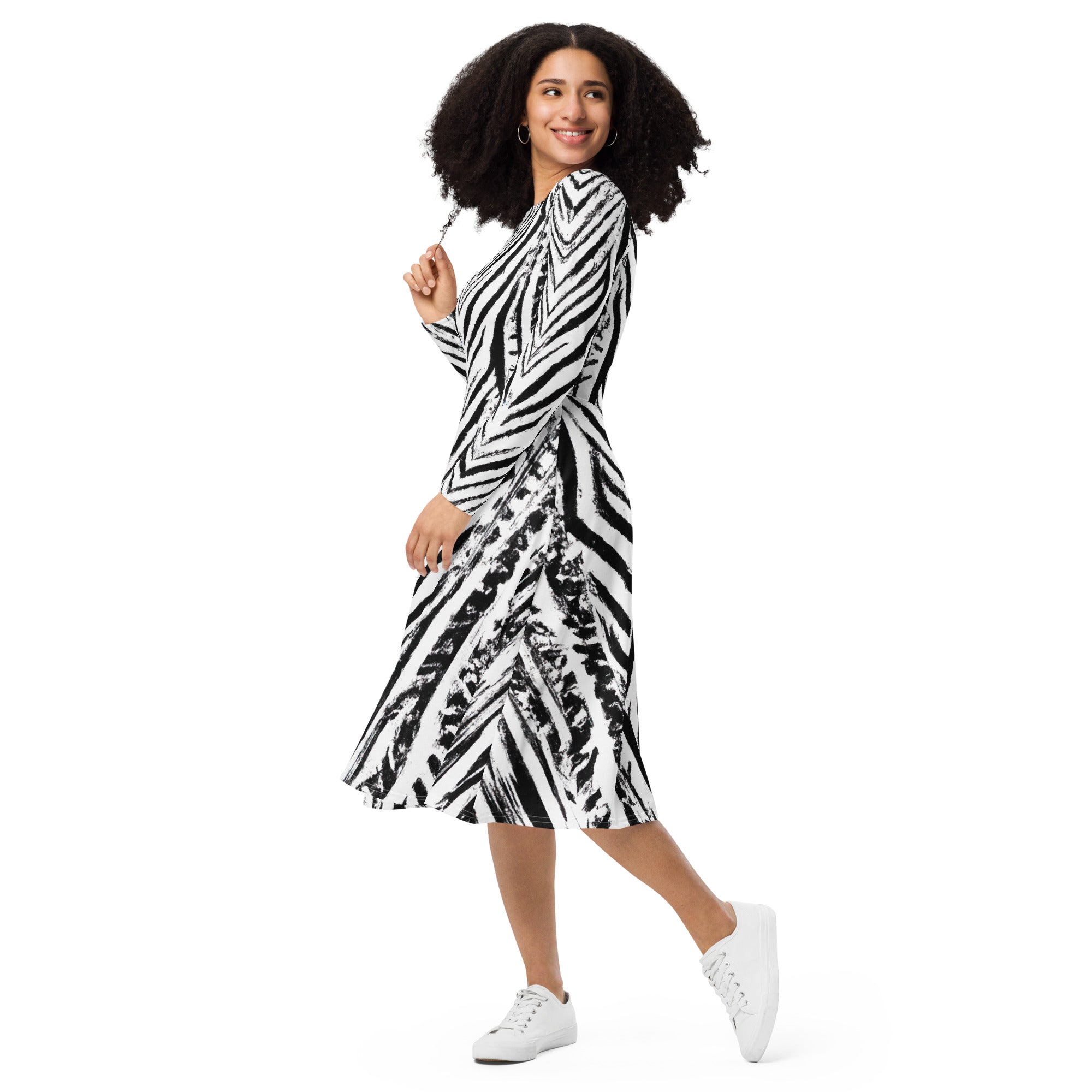 Womens Long Sleeve Midi Dress featuring a black and white native print, showcasing its fitted waist, flared bottom, and side pockets.