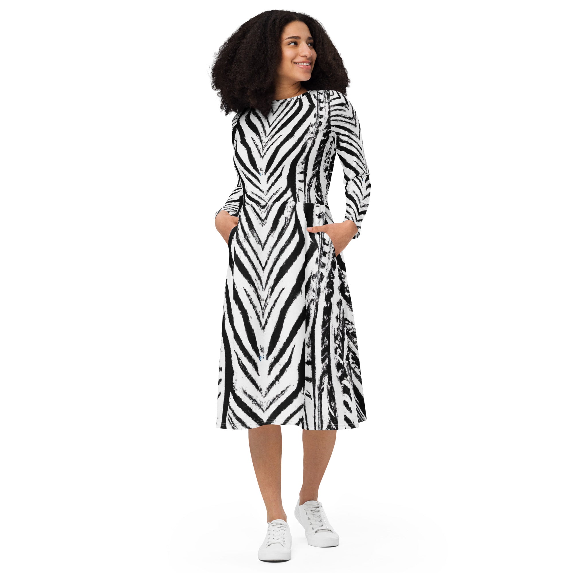 Womens Long Sleeve Midi Dress featuring a black and white native print, showcasing its fitted waist, flared bottom, and side pockets.