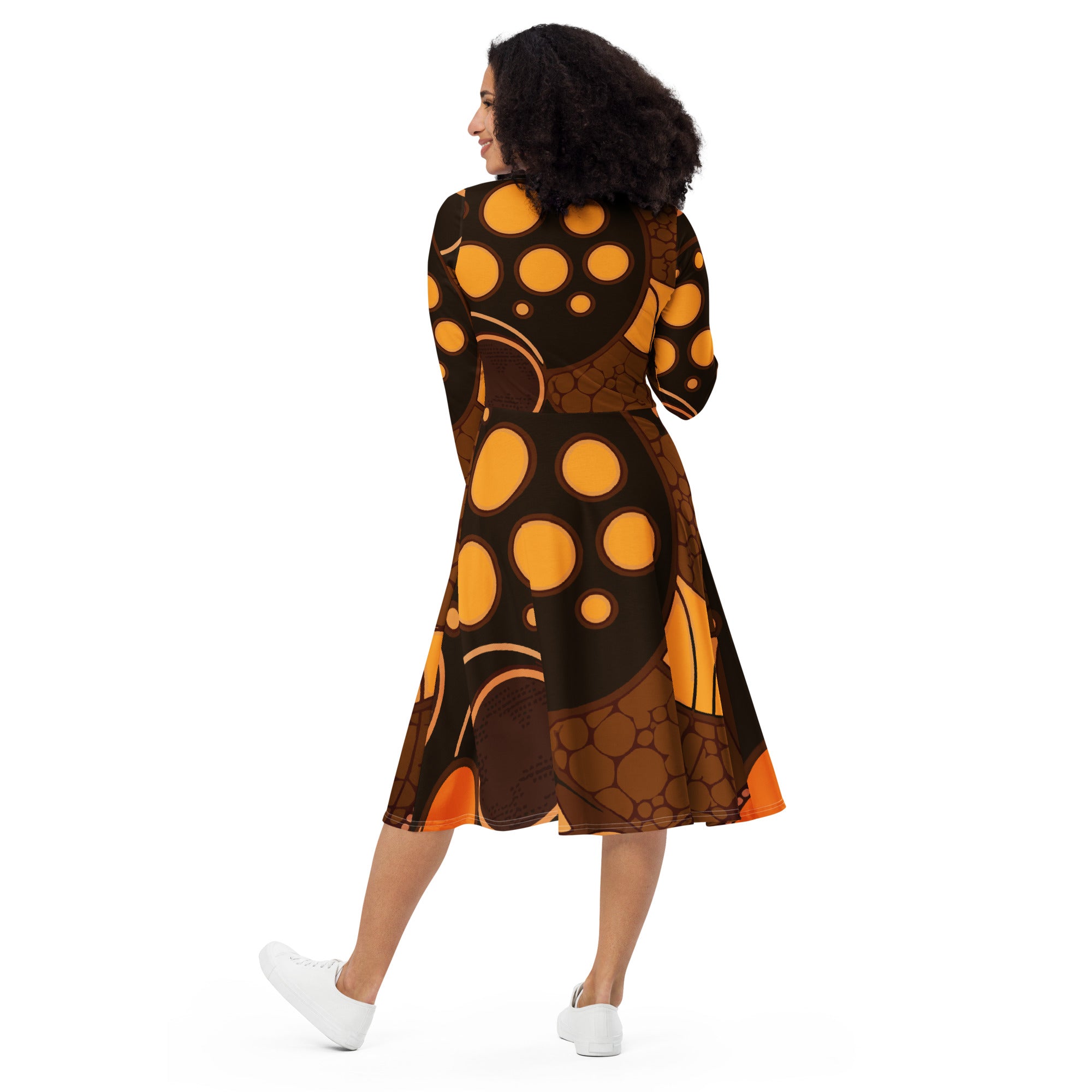 Womens Long Sleeve Midi Dress in orange brown spotted print, featuring a fitted waist, flared bottom, and side pockets.