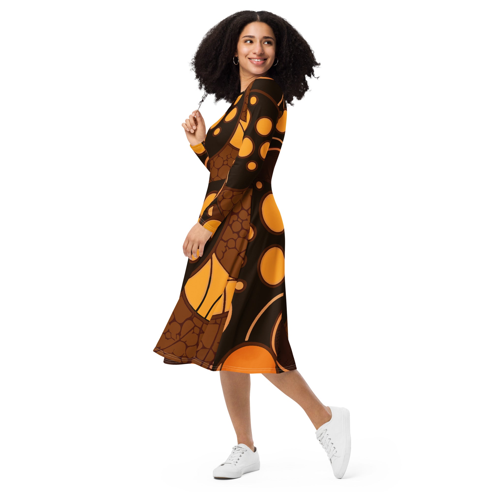 Womens Long Sleeve Midi Dress in orange brown spotted print, featuring a fitted waist, flared bottom, and side pockets.