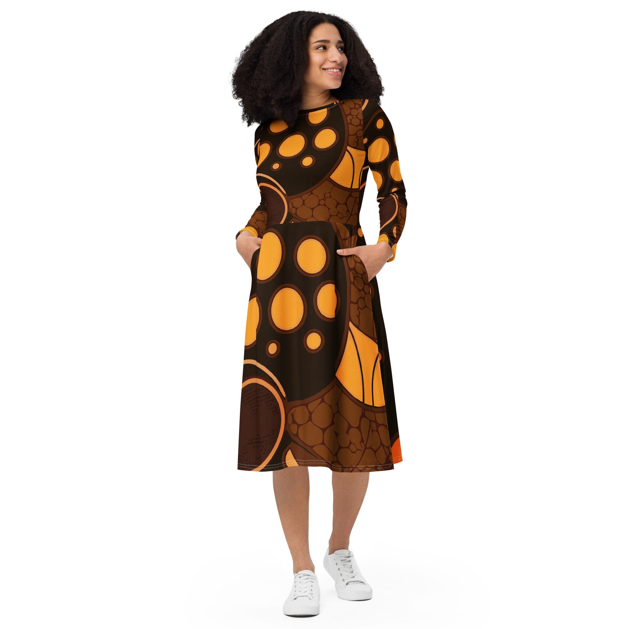 Womens Long Sleeve Midi Dress in orange brown spotted print, featuring a fitted waist, flared bottom, and side pockets.