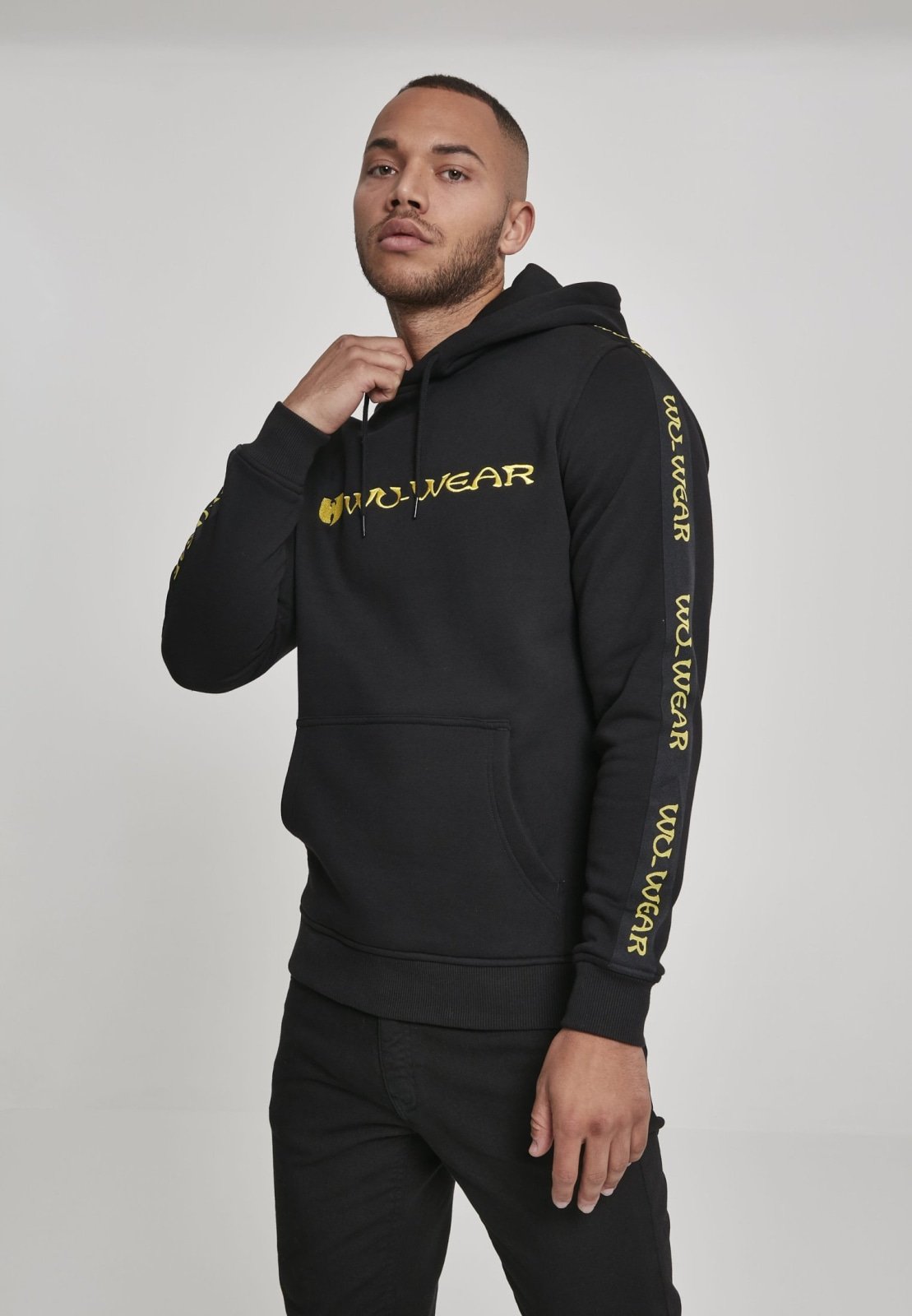 Wu-Wear Tape Hoodie featuring unique sidetape and front embroidery, crafted from soft half brushed fleece fabric.