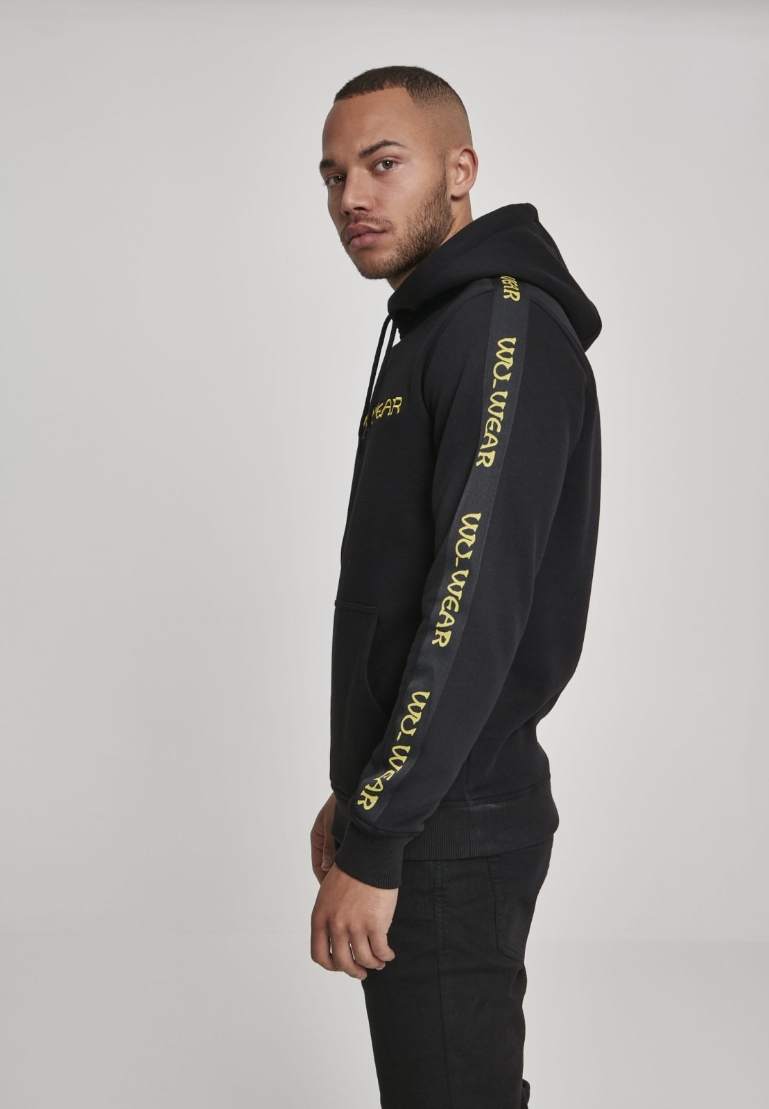 Wu-Wear Tape Hoodie featuring unique sidetape and front embroidery, crafted from soft half brushed fleece fabric.