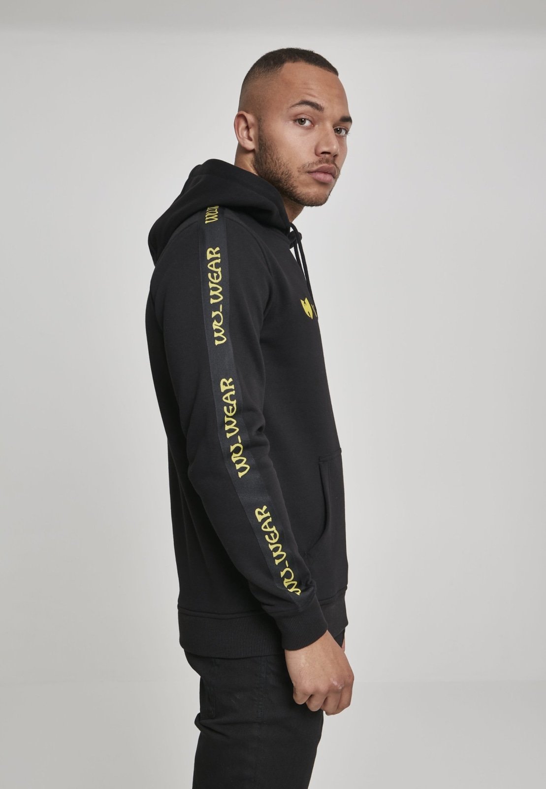 Wu-Wear Tape Hoodie featuring unique sidetape and front embroidery, crafted from soft half brushed fleece fabric.