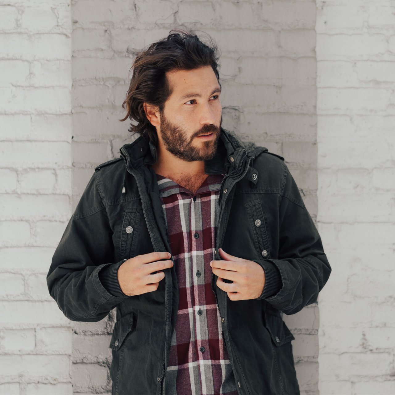 Zach Long Cotton Jacket featuring a detachable hood, sherpa lining, and multiple pockets in a stylish garment dyed design.