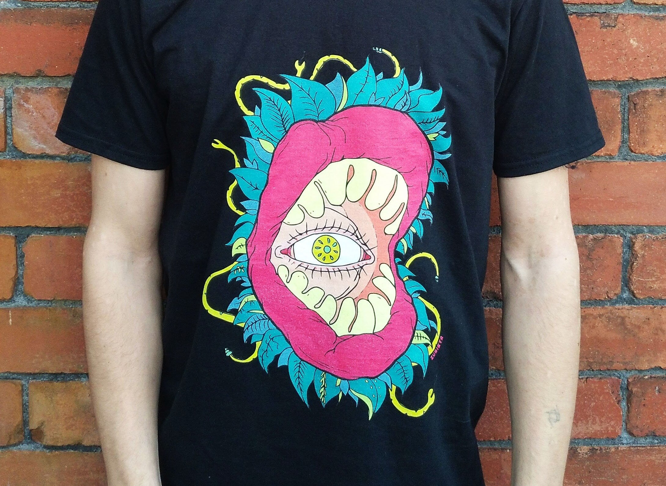 All Seeing Eye T-shirt featuring a vibrant design inspired by the subconscious and tropical jungles, made from 100% cotton.