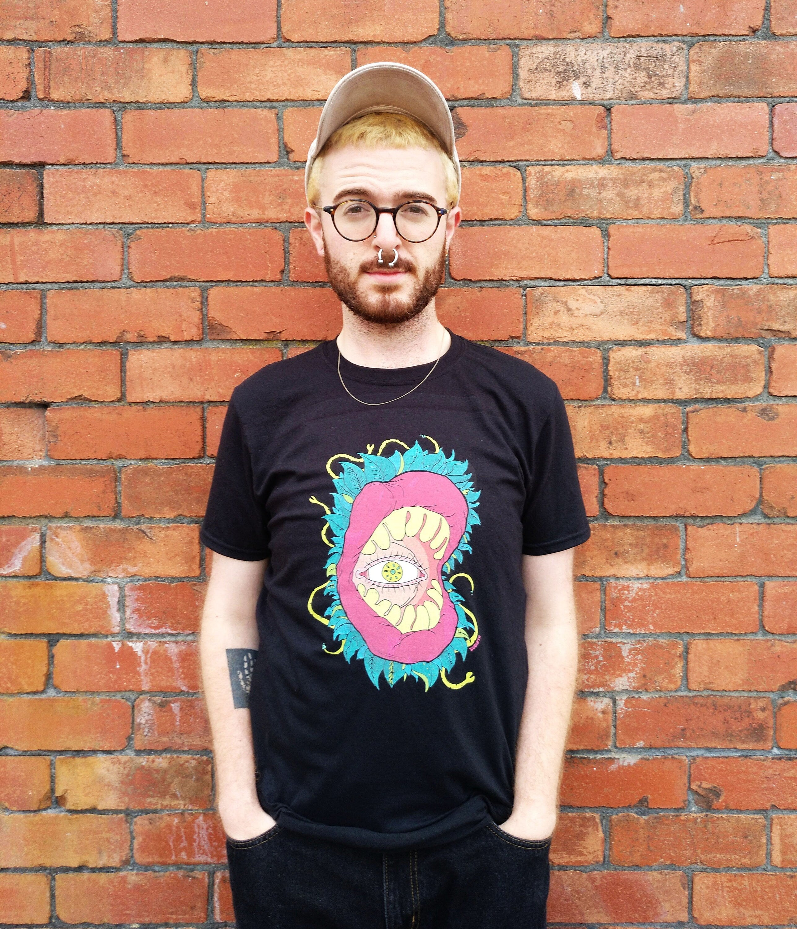 All Seeing Eye T-shirt featuring a vibrant design inspired by the subconscious and tropical jungles, made from 100% cotton.