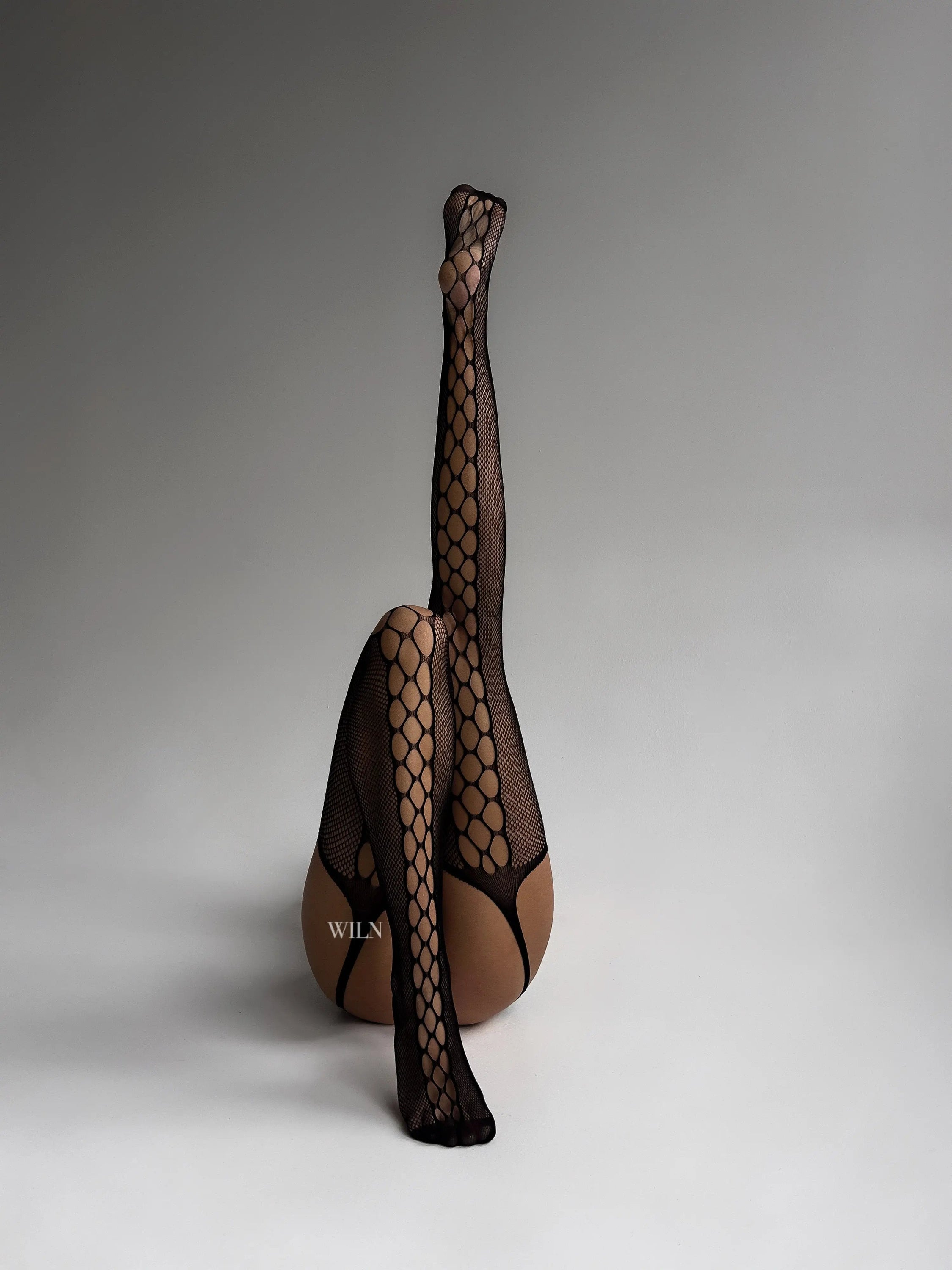 BAIT Stockings featuring rhinestone cut-out design in black, suspender-style fishnet tights for a sexy look.