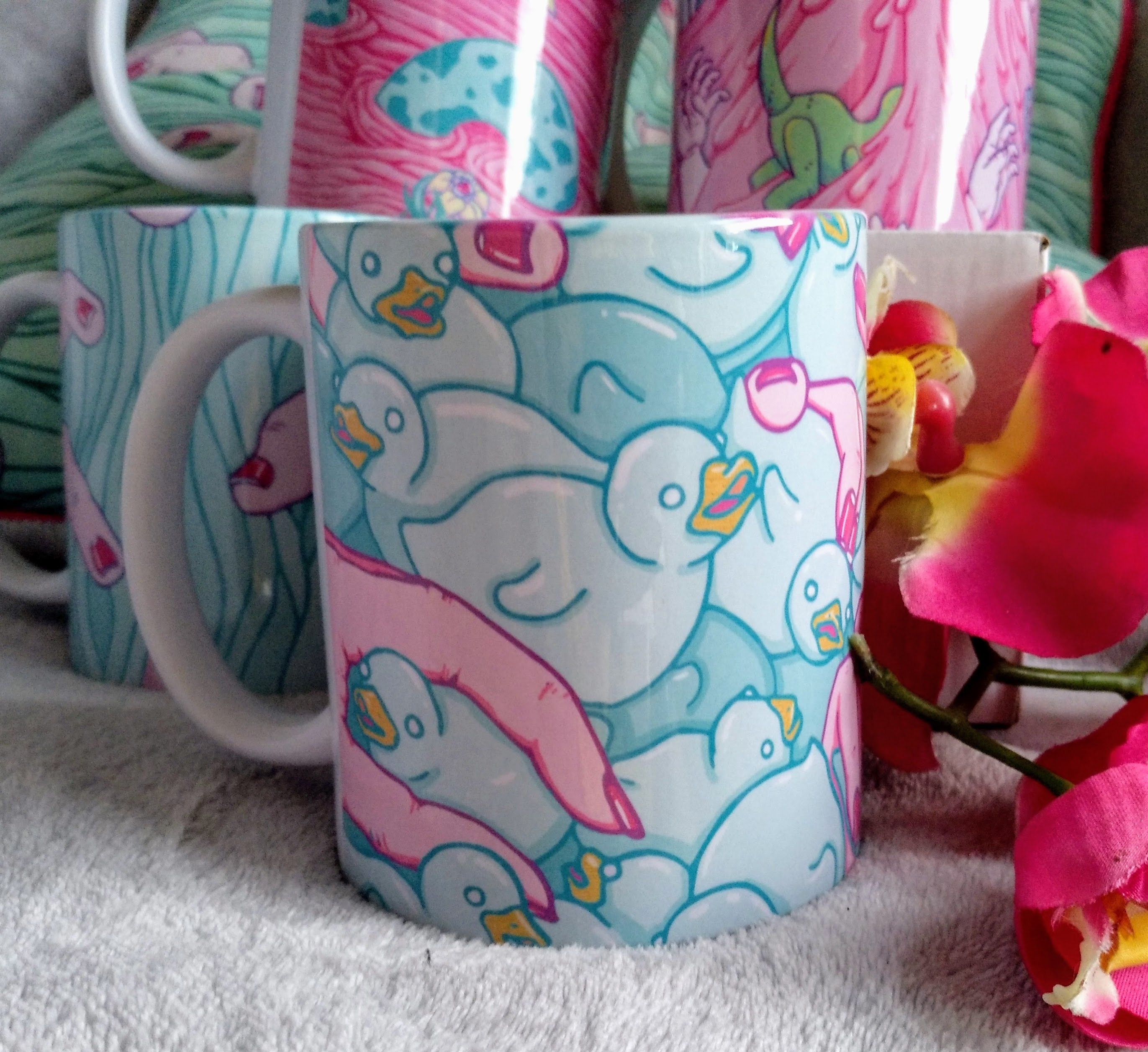 A high-quality ceramic mug featuring colorful Duckies artwork, perfect for enjoying beverages.