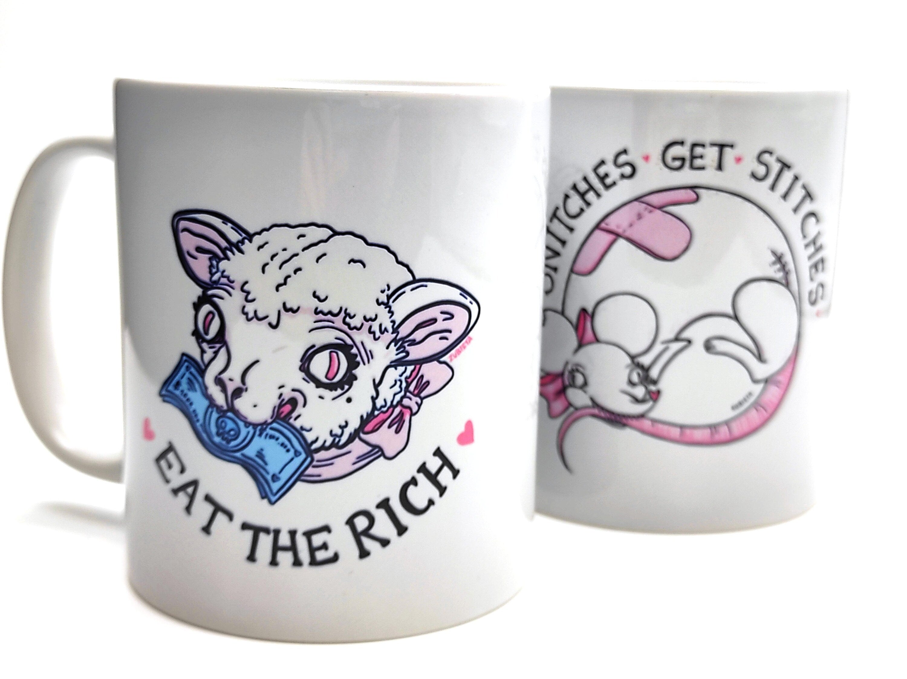 Ceramic mug with the phrase 'Eat The Rich' printed in bold, featuring a high-quality design and durable finish.