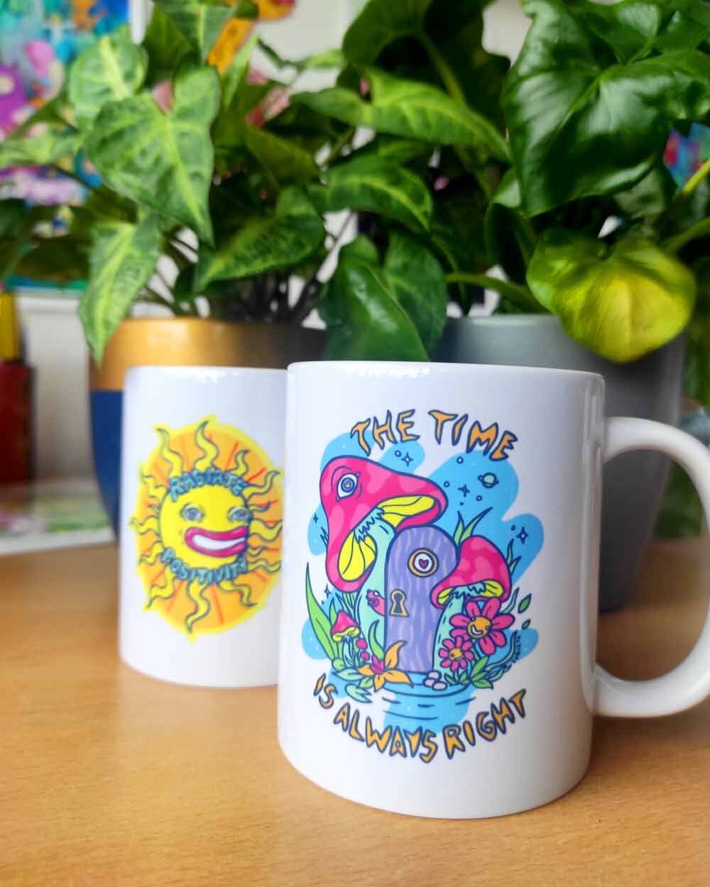 Ceramic mug with colorful design 'The Time Is Always Right', showcasing its vibrant print and sturdy handle.