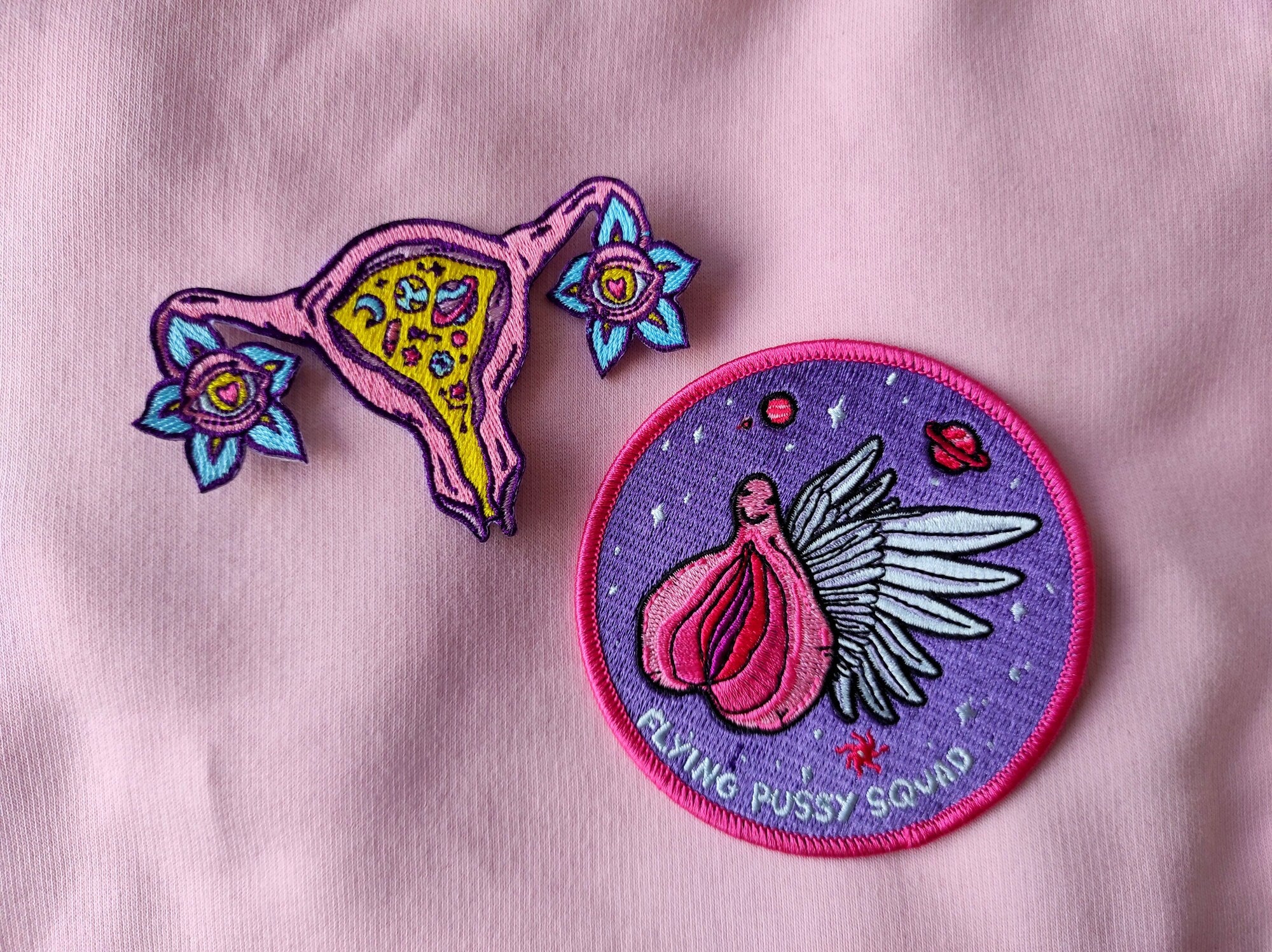 Cosmic Uterus Patch featuring a psychedelic embroidered design in six vibrant colors, measuring 12.5cm x 12.5cm.