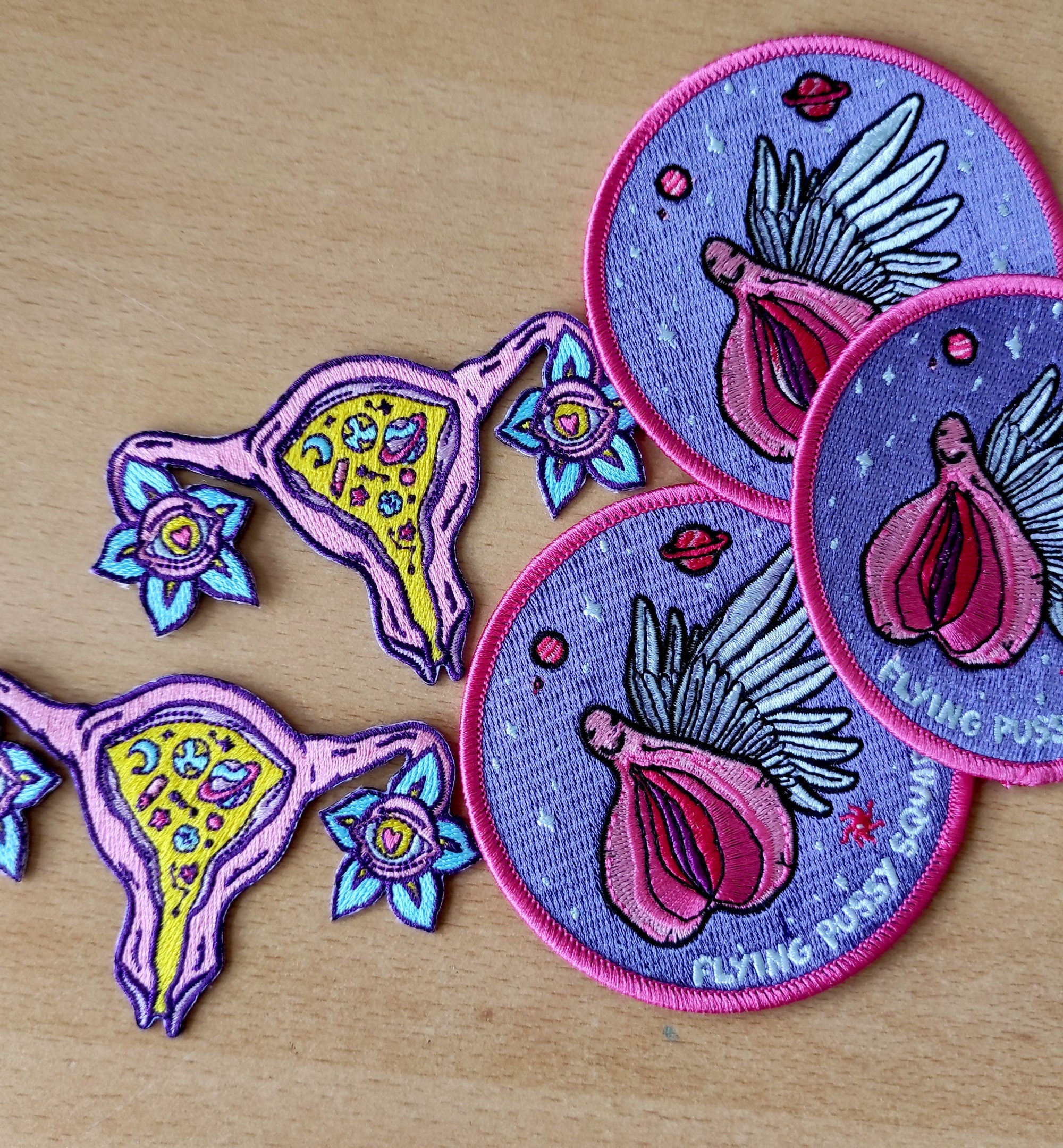 Cosmic Uterus Patch featuring a psychedelic embroidered design in six vibrant colors, measuring 12.5cm x 12.5cm.