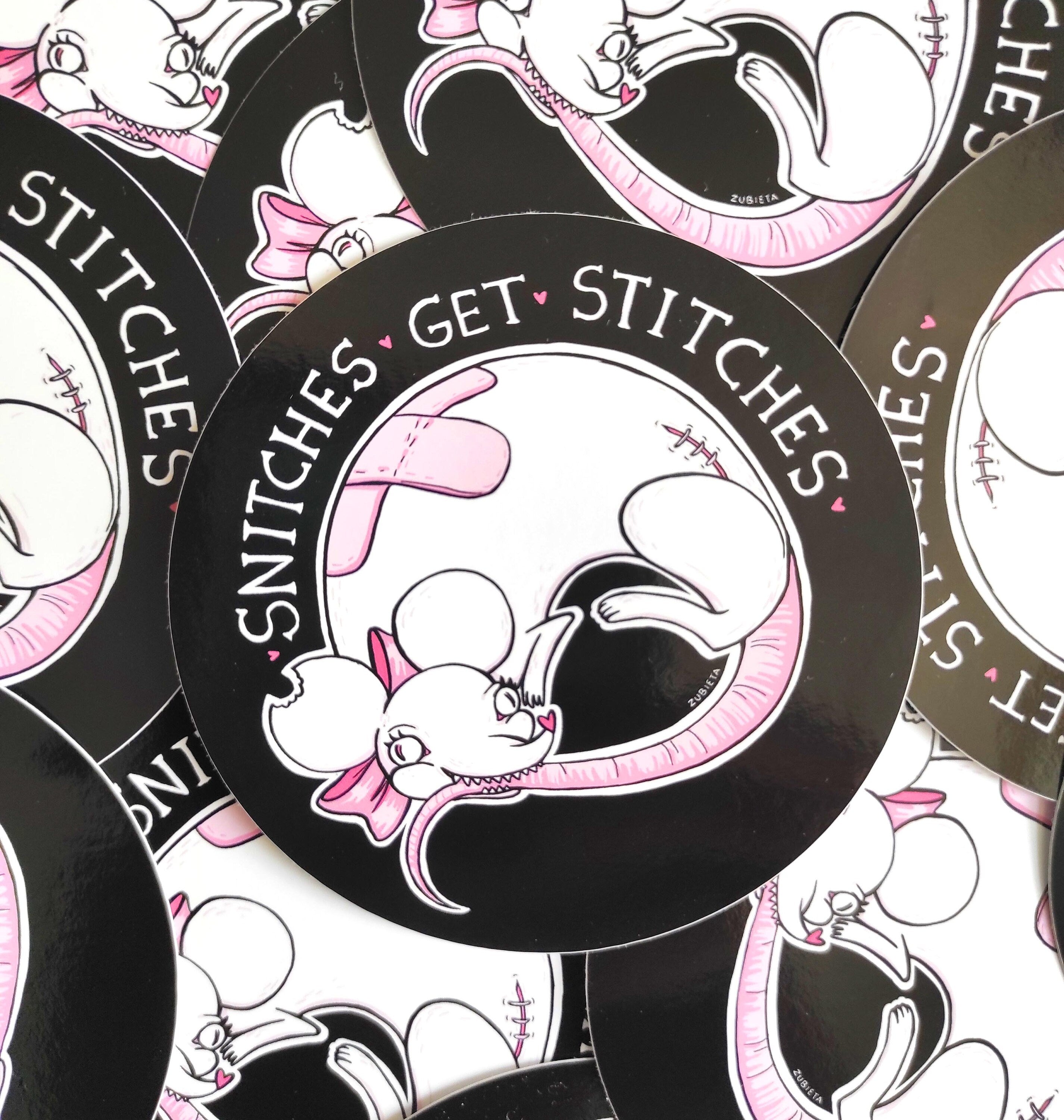 Cute Evil Sticker Pack featuring 'Eat the Rich' and 'Snitches Get Stitches' designs on high-quality vinyl.