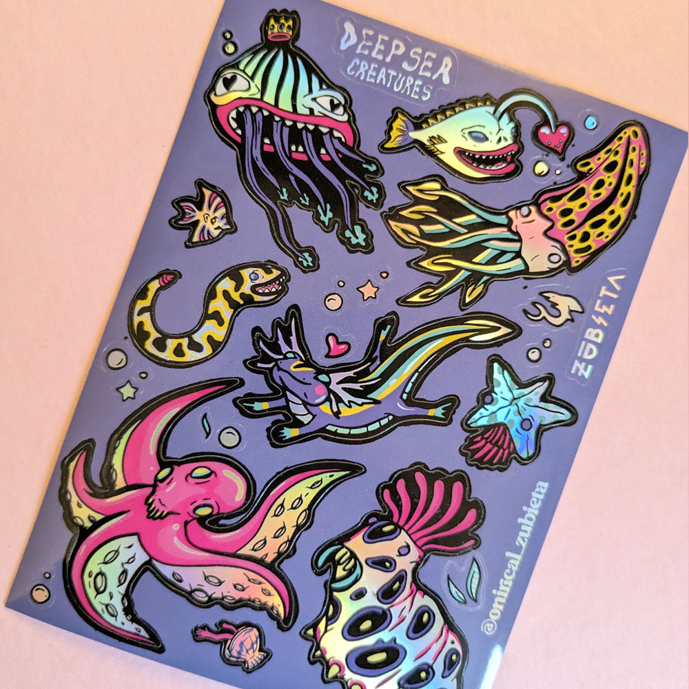 A vibrant A6 holographic sticker sheet featuring various deep sea creatures, showcasing colorful and psychedelic designs.