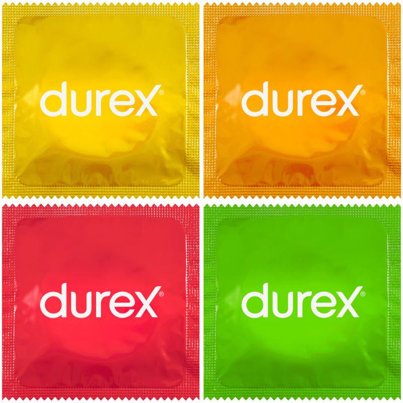 Durex Select Flavours condoms in assorted colors and flavors, including strawberry, banana, orange, and apple, packaged attractively.