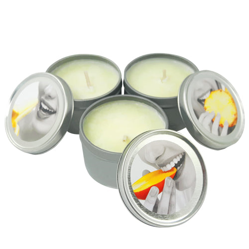 Earthly Body 3-in-1 Massage Candle Tropical Threesome, three scented candles in elegant packaging, designed for massage and skin nourishment.