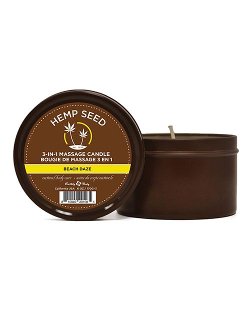 Earthly Body Hemp 3-in-1 Candle in a round tin with Beach Daze scent, featuring a tropical design and a lit wick.