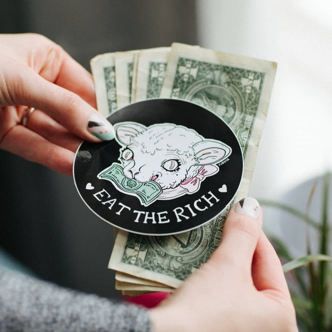 Eat the Rich Sticker featuring a round design with bold text and vibrant colors, perfect for personalizing laptops and water bottles.