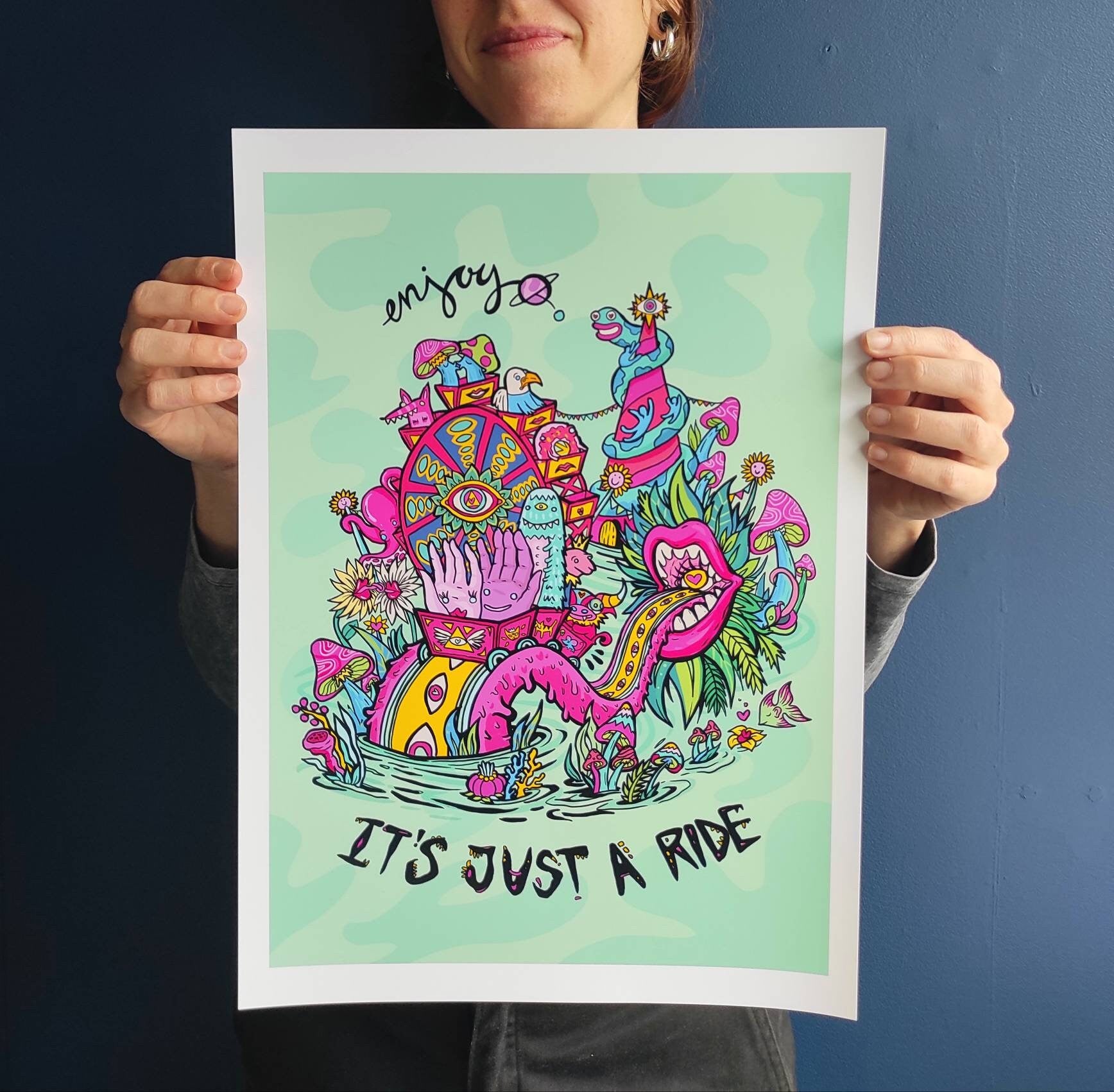 A vibrant gicleé fine art print titled 'Enjoy, It's Just A Ride', featuring a motivational quote by Bill Hicks, hand-signed and limited edition.