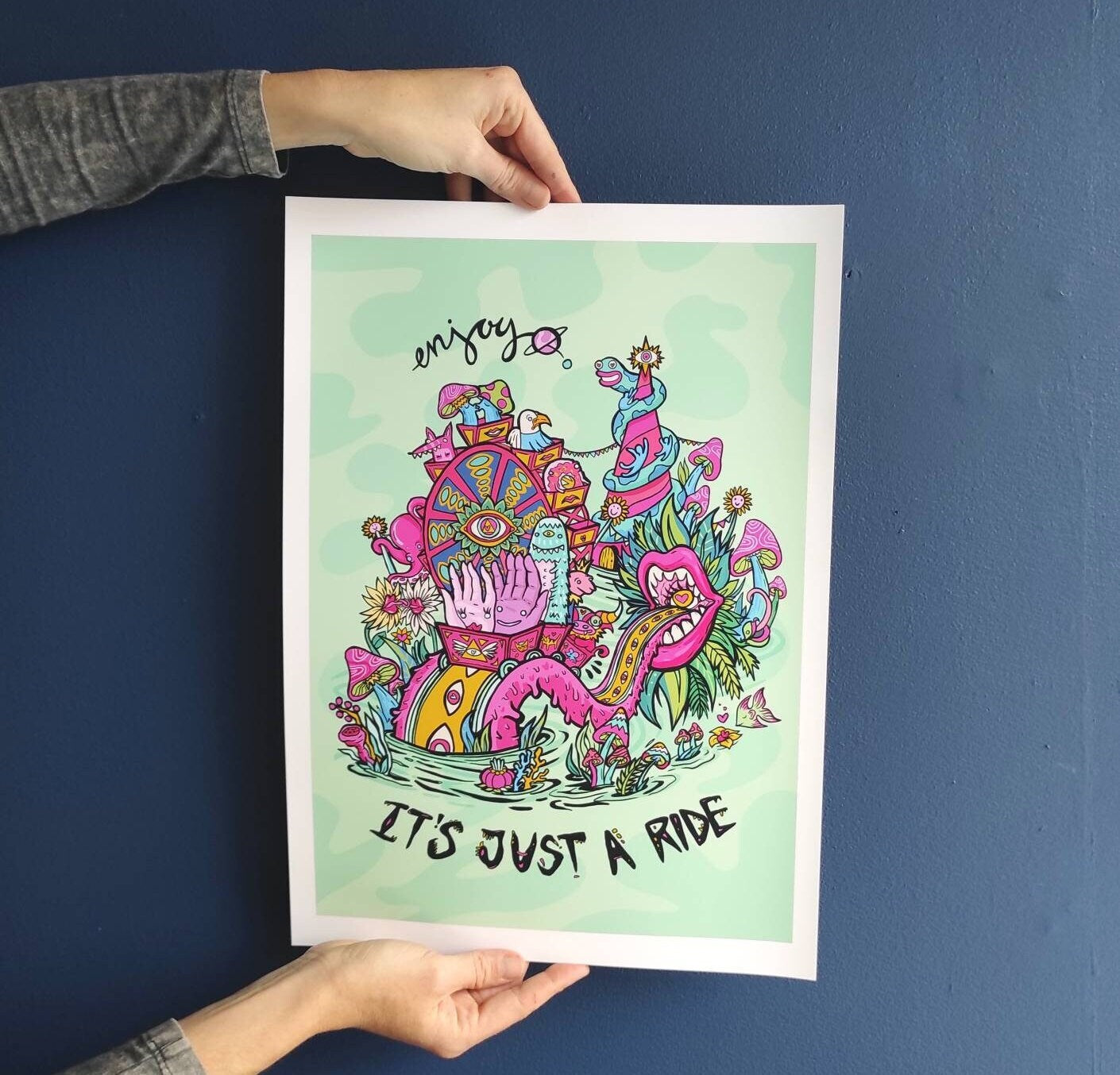 A vibrant gicleé fine art print titled 'Enjoy, It's Just A Ride', featuring a motivational quote by Bill Hicks, hand-signed and limited edition.