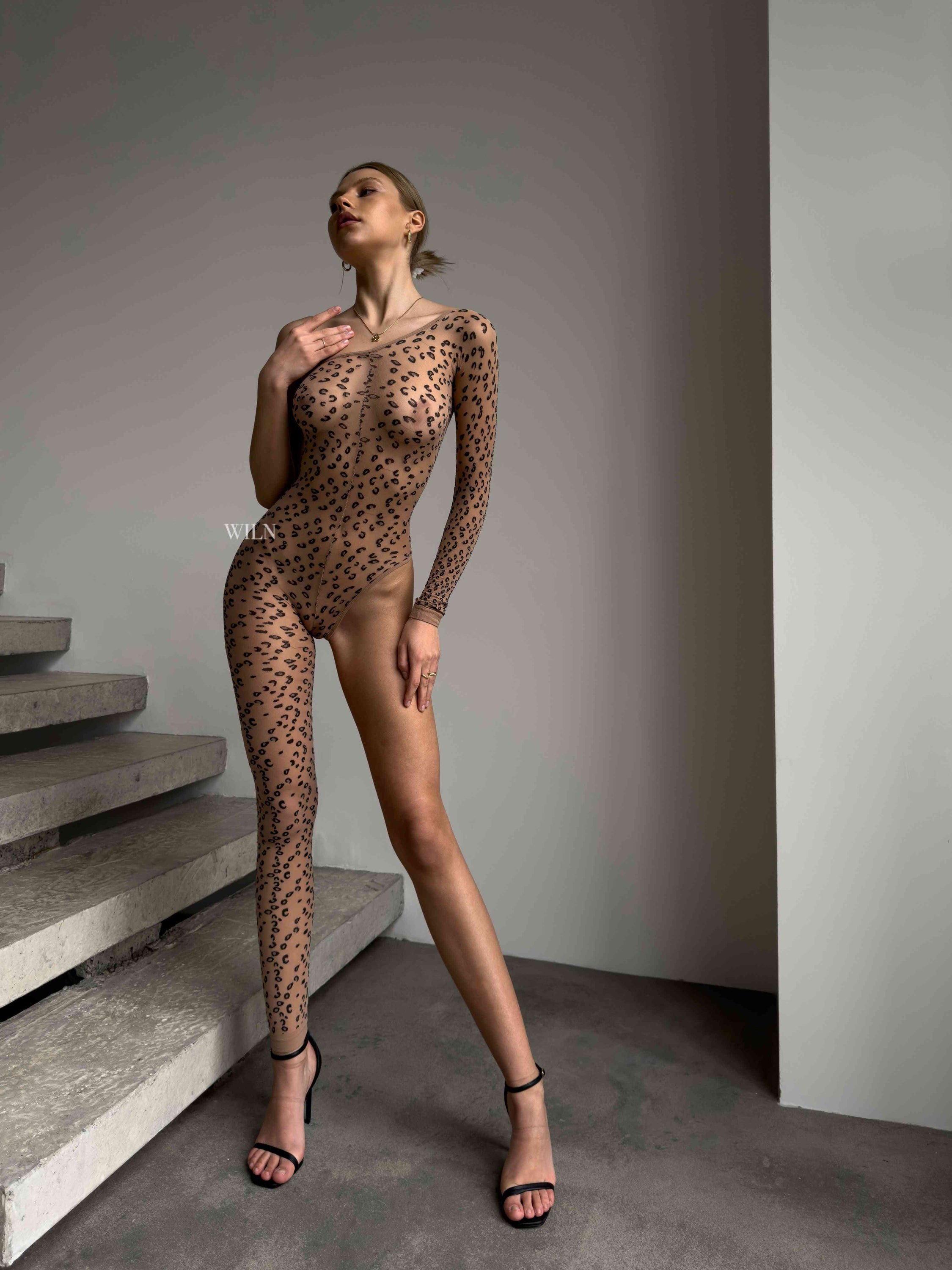 Feline Nude Bodysuit featuring a stunning cheetah print design, perfect for accentuating curves and enhancing confidence.