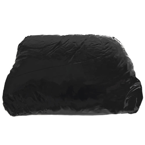 Fetish Collection Black Lack Fitted Sheet on a bed, showcasing its glossy black surface and fitted design.