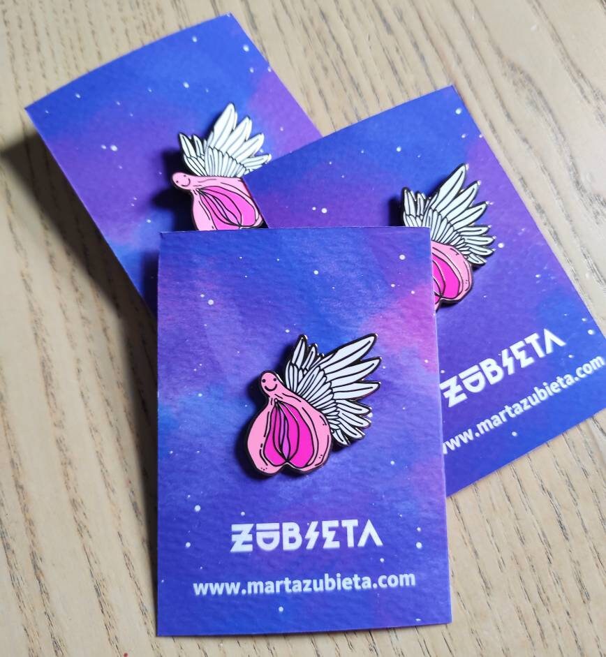 A colorful enamel pin featuring a whimsical design of flying vaginas in space, symbolizing body positivity and empowerment.