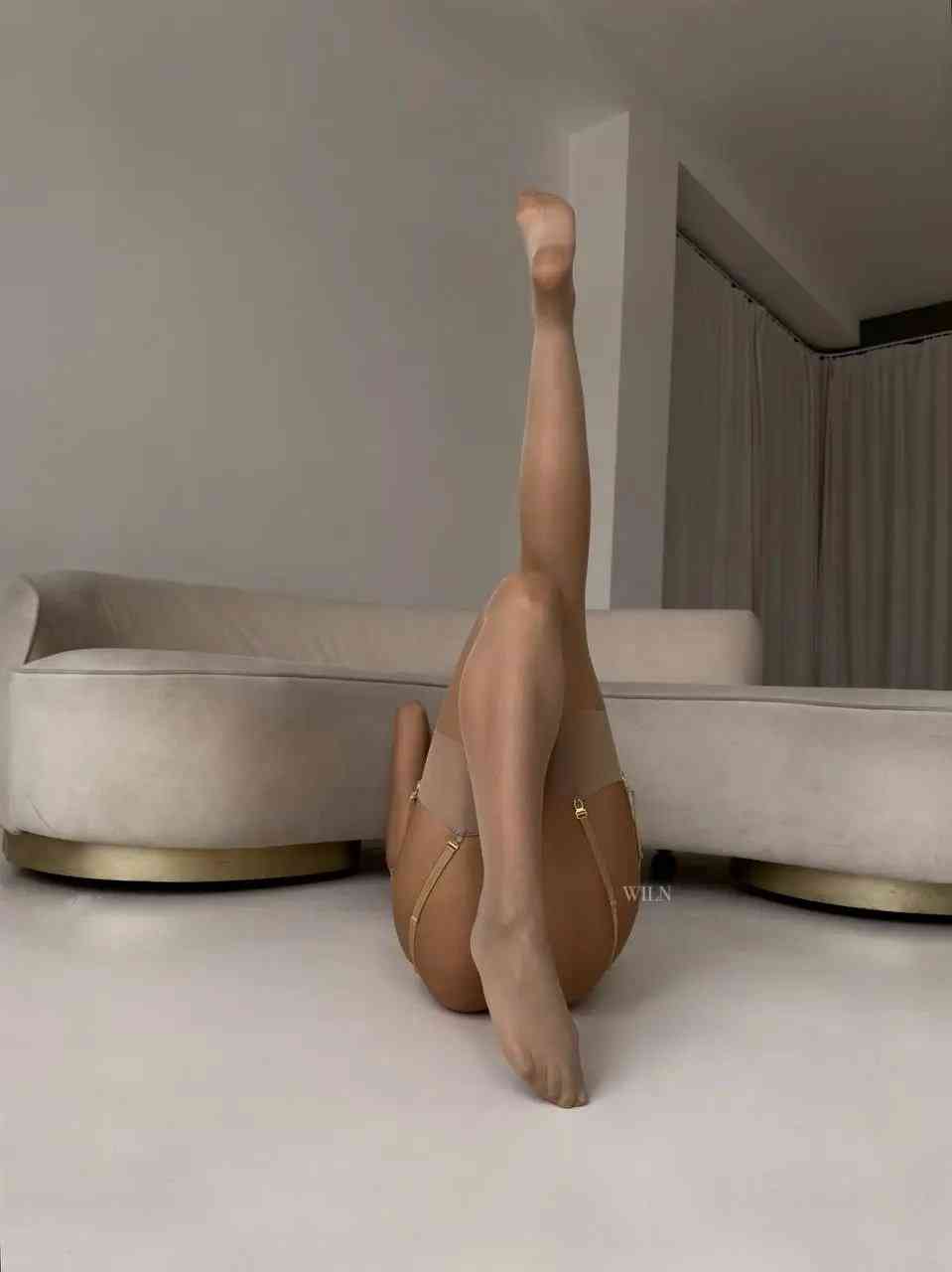 A pair of elegant GLAM Stockings Nude, showcasing a shimmering finish and perfect fit, ideal for enhancing any outfit.