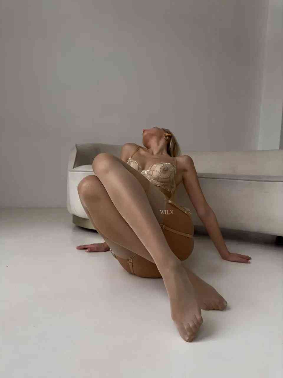 A pair of elegant GLAM Stockings Nude, showcasing a shimmering finish and perfect fit, ideal for enhancing any outfit.