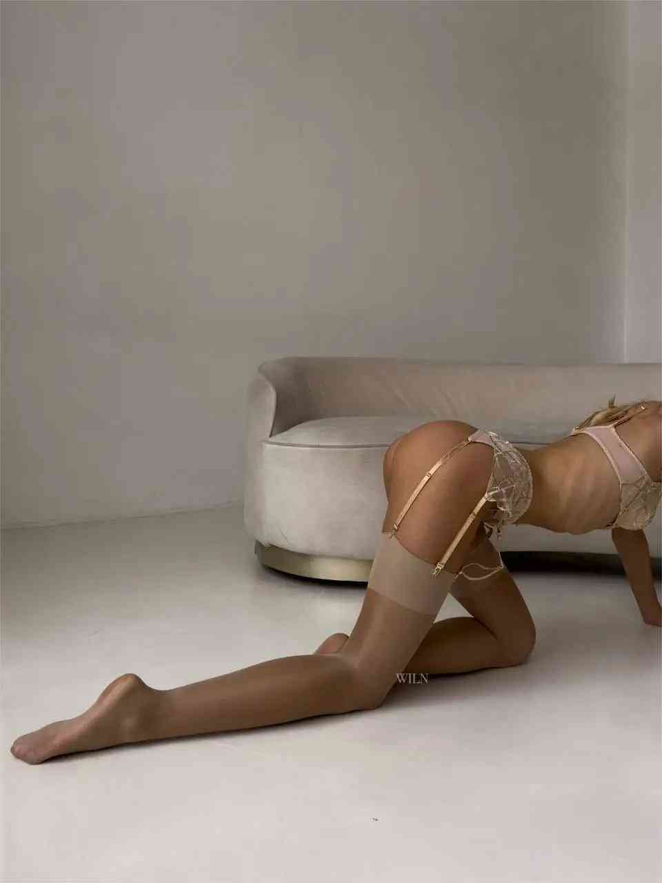 A pair of elegant GLAM Stockings Nude, showcasing a shimmering finish and perfect fit, ideal for enhancing any outfit.